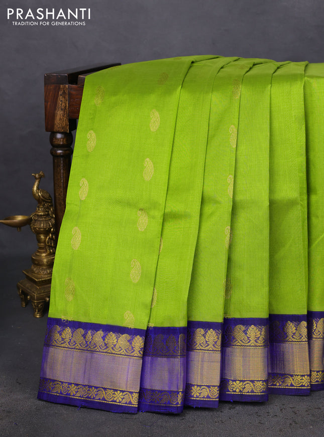 Kuppadam silk cotton saree light green and blue with paisley zari woven buttas and zari woven border