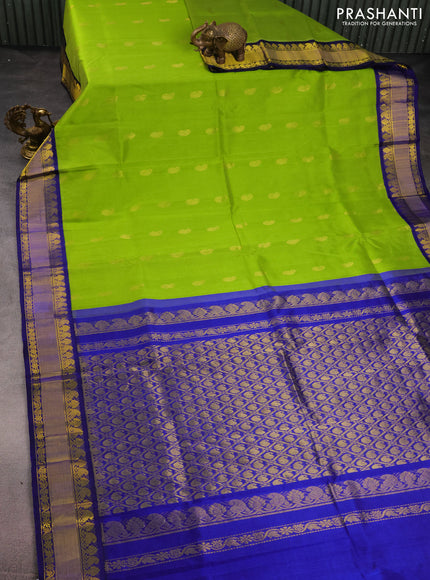 Kuppadam silk cotton saree light green and blue with paisley zari woven buttas and zari woven border