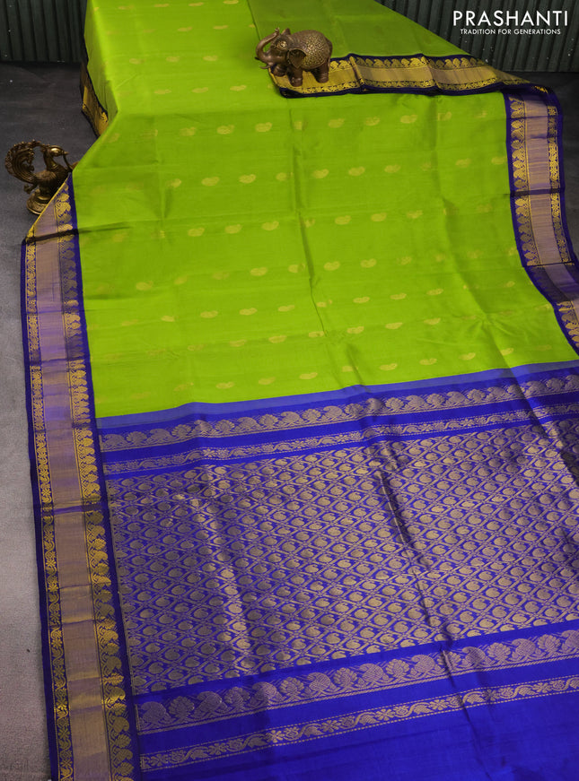 Kuppadam silk cotton saree light green and blue with paisley zari woven buttas and zari woven border