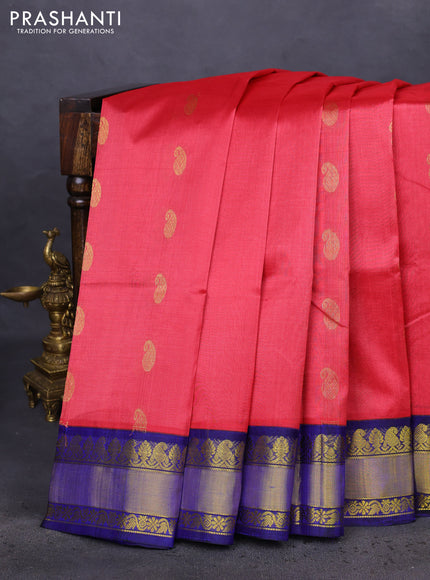 Kuppadam silk cotton saree tomato red and blue with paisley zari woven buttas and zari woven border