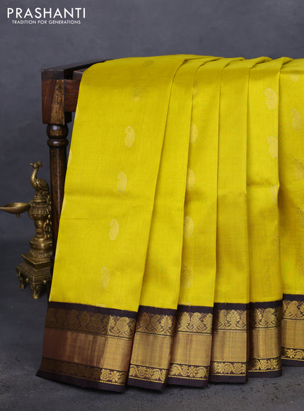 Kuppadam silk cotton saree yellow and black with paisley zari woven buttas and zari woven border