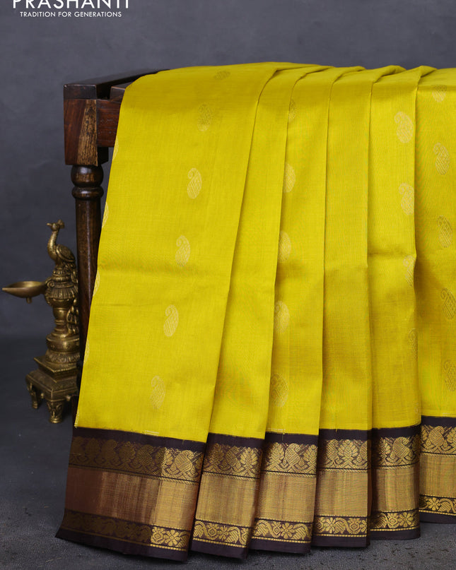 Kuppadam silk cotton saree yellow and black with paisley zari woven buttas and zari woven border