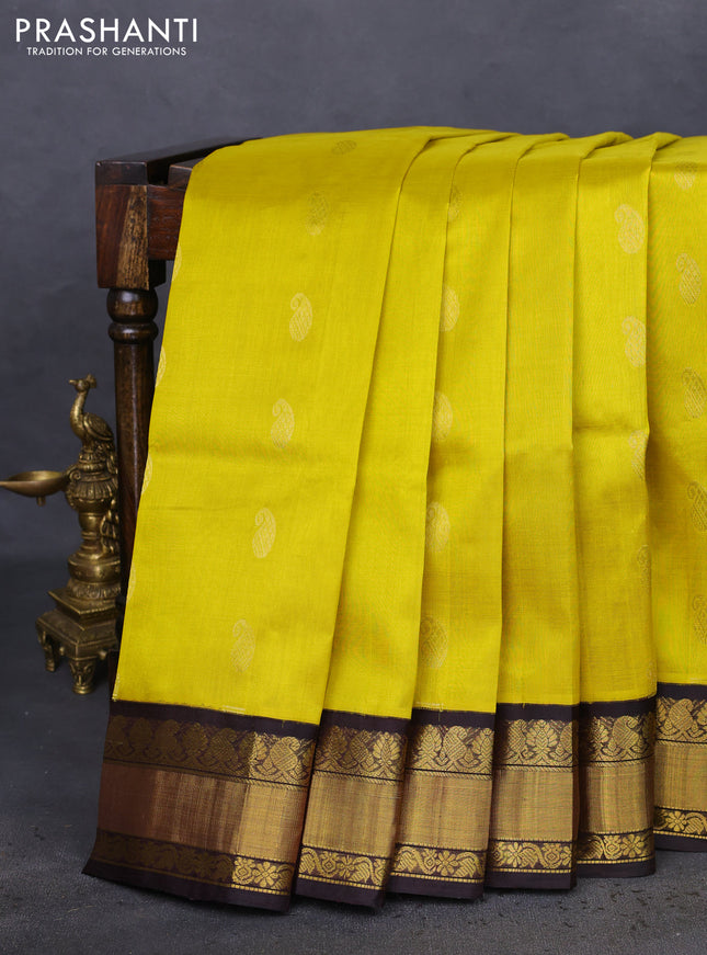Kuppadam silk cotton saree yellow and black with paisley zari woven buttas and zari woven border