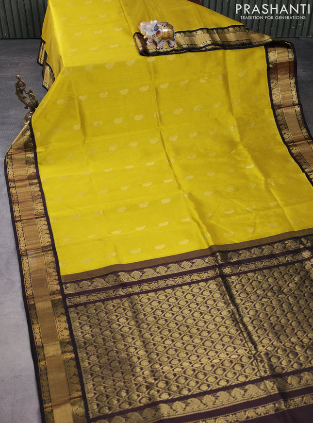 Kuppadam silk cotton saree yellow and black with paisley zari woven buttas and zari woven border