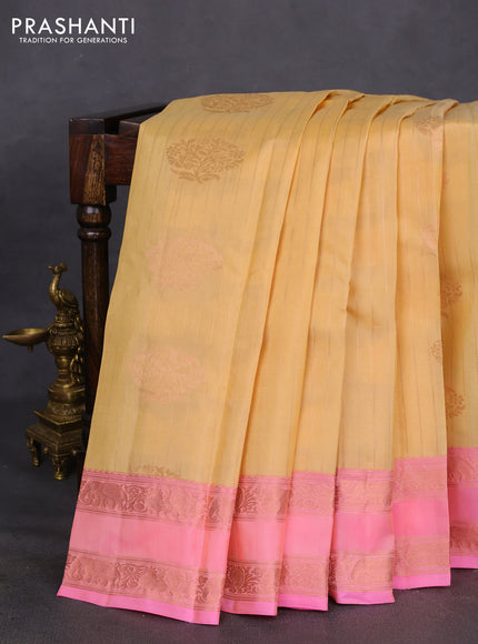 Kanchipuram silk saree pale yellow and light pink with allover copper zari weaves & buttas and copper rettapet zari woven border