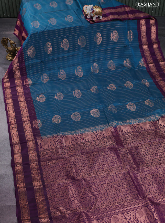 Kanchipuram silk saree peacock blue and purple with allover copper zari weaves & buttas and copper rettapet zari woven border