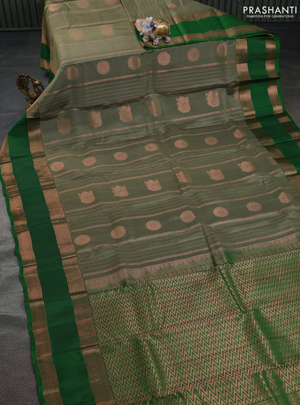 Kanchipuram silk saree elaichi green and green with allover copper zari weaves & buttas and rettapet copper zari woven border