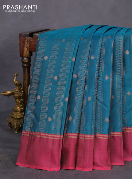 Kanchipuram silk saree peacock blue and dark magenta pink with allover copper zari weaves and copper zari woven simple border