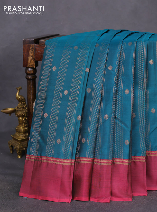 Kanchipuram silk saree peacock blue and dark magenta pink with allover copper zari weaves and copper zari woven simple border