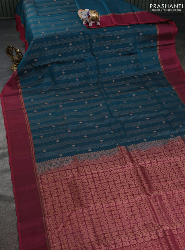 Kanchipuram silk saree peacock blue and dark magenta pink with allover copper zari weaves and copper zari woven simple border