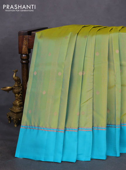 Kanchipuram silk saree dual shade of green and teal blue with allover copper zari weaves and copper zari woven simple border