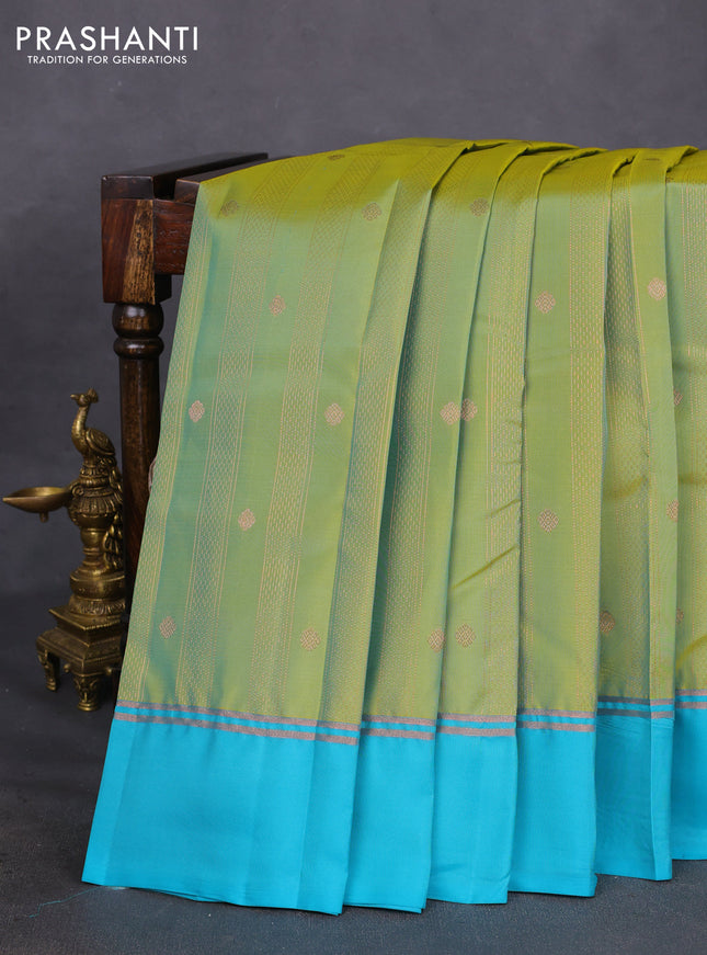 Kanchipuram silk saree dual shade of green and teal blue with allover copper zari weaves and copper zari woven simple border
