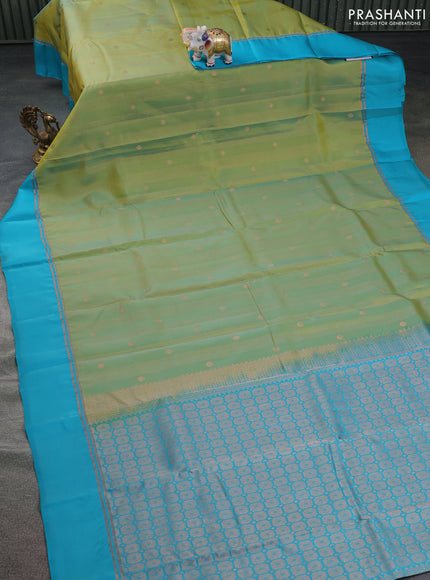 Kanchipuram silk saree dual shade of green and teal blue with allover copper zari weaves and copper zari woven simple border
