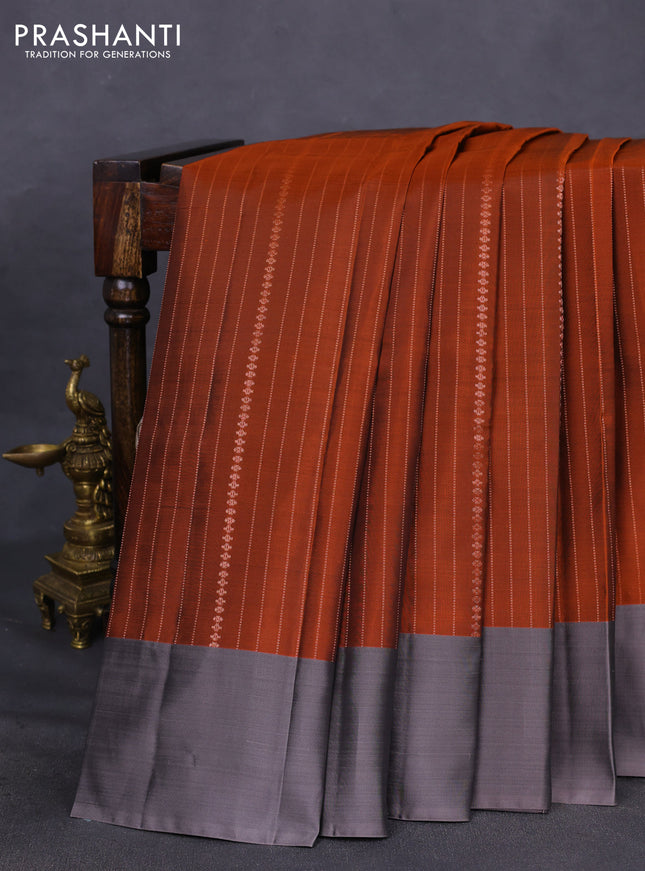 Kanchipuram silk saree rust shade and grey with allover copper zari weaves and simple border