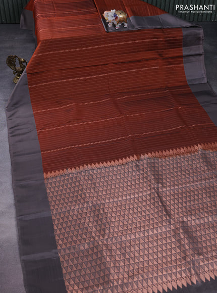 Kanchipuram silk saree rust shade and grey with allover copper zari weaves and simple border