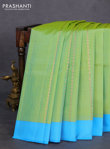 Kanchipuram silk saree dual shade of green and blue with allover copper zari weaves and simple border
