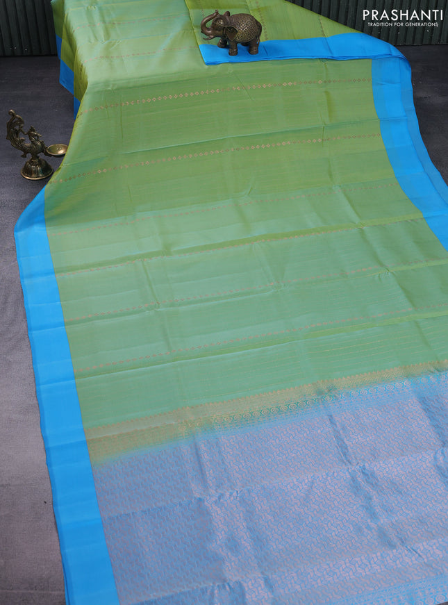 Kanchipuram silk saree dual shade of green and blue with allover copper zari weaves and simple border