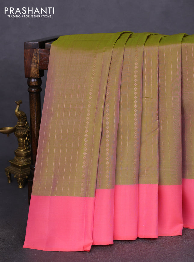 Kanchipuram silk saree dual shade of green and peach pink with allover copper zari weaves and simple border
