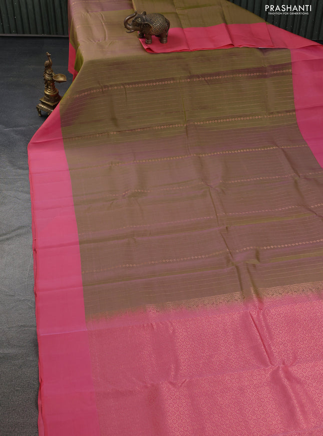 Kanchipuram silk saree dual shade of green and peach pink with allover copper zari weaves and simple border