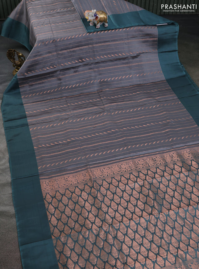 Kanchipuram silk saree grey and pasetel blue with allover copper zari weaves and simple border