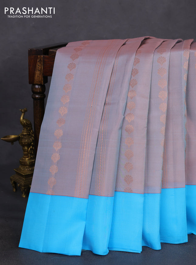Kanchipuram silk saree dual shade of pastel pink and light blue with allover copper zari weaves and simple border