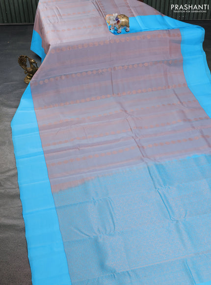 Kanchipuram silk saree dual shade of pastel pink and light blue with allover copper zari weaves and simple border