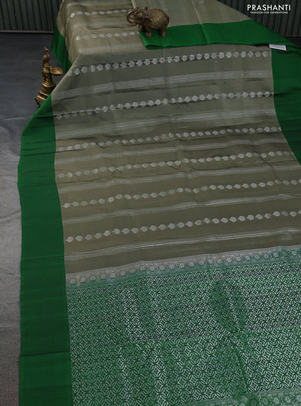 Kanchipuram silk saree elaichi green and green with allover silver zari weaves and simple border