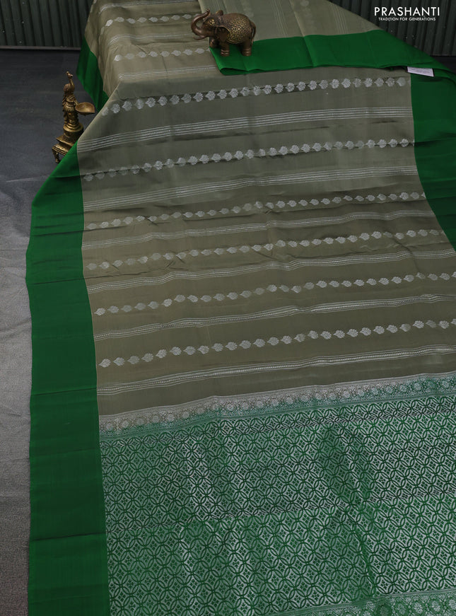 Kanchipuram silk saree elaichi green and green with allover silver zari weaves and simple border