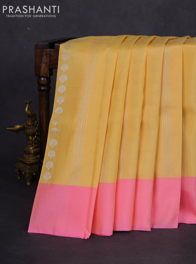Kanchipuram silk saree pale yellow and light pink with allover silver zari weaves and simple border