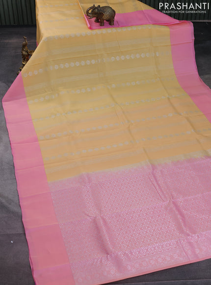 Kanchipuram silk saree pale yellow and light pink with allover silver zari weaves and simple border