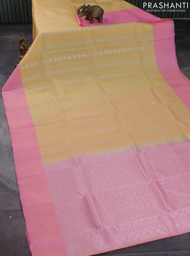 Kanchipuram silk saree pale yellow and light pink with allover silver zari weaves and simple border