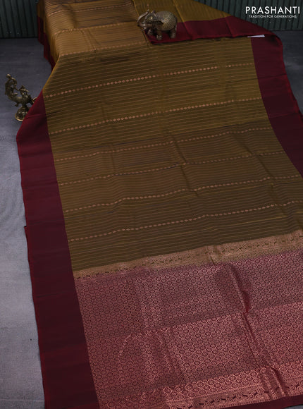 Kanchipuram silk saree mustard green and maroon with allover copper zari weaves and simple border