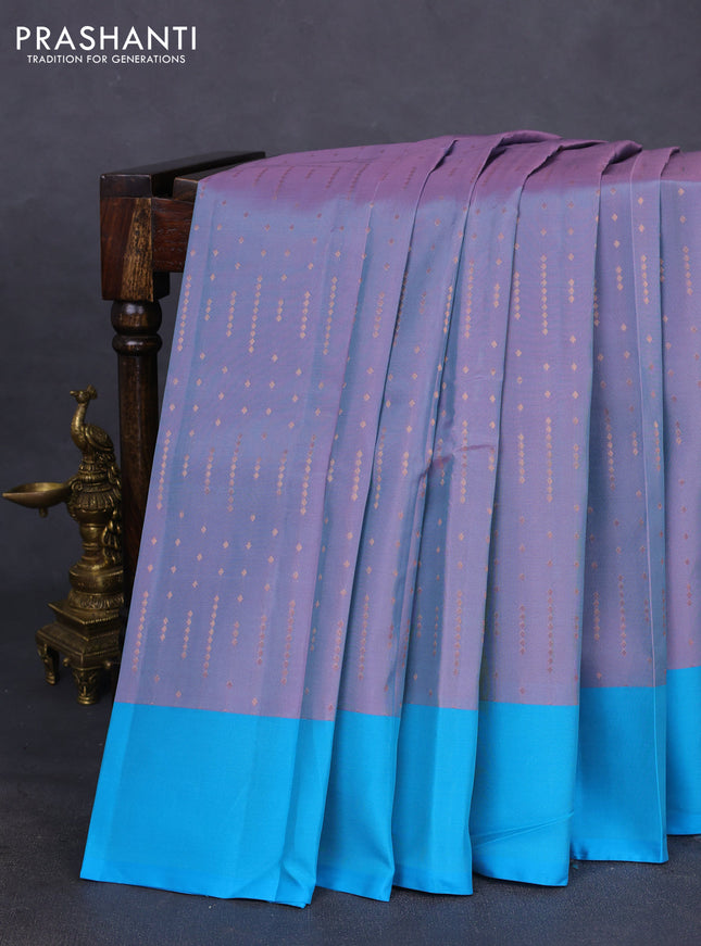 Kanchipuram silk saree dual shade of pastel pink and teal blue with allover copper zari woven butta weaves and simple border