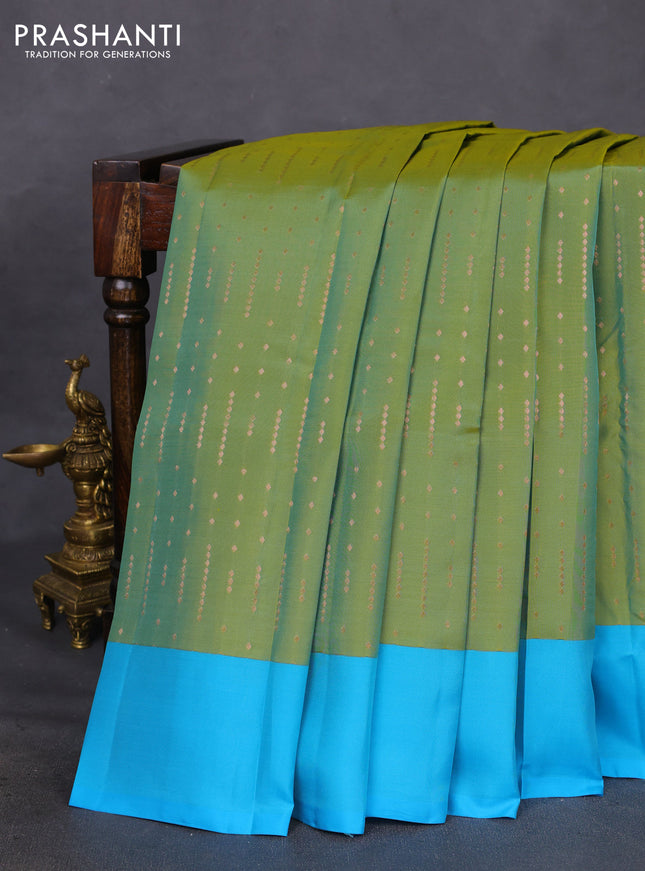 Kanchipuram silk saree dual shade of green and cs blue with allover copper zari woven butta weaves and simple border