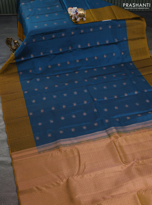 Kanchipuram silk saree peacock blue and dark mustard with copper zari woven buttas and self emboss border