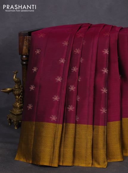 Kanchipuram silk saree dark magenta pink and dark mustard with copper zari woven buttas and self emboss border