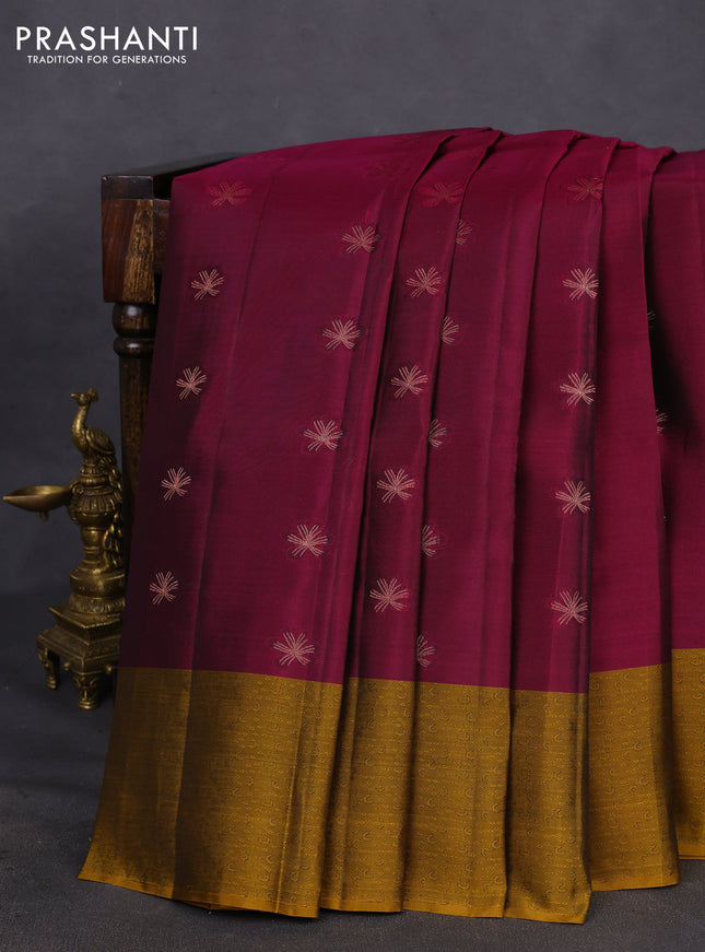 Kanchipuram silk saree dark magenta pink and dark mustard with copper zari woven buttas and self emboss border