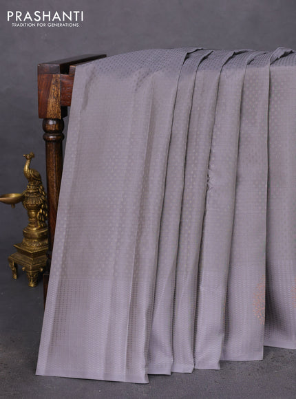 Kanchipuram silk saree grey and teal blue with allover self emboss and copper zari woven buttas