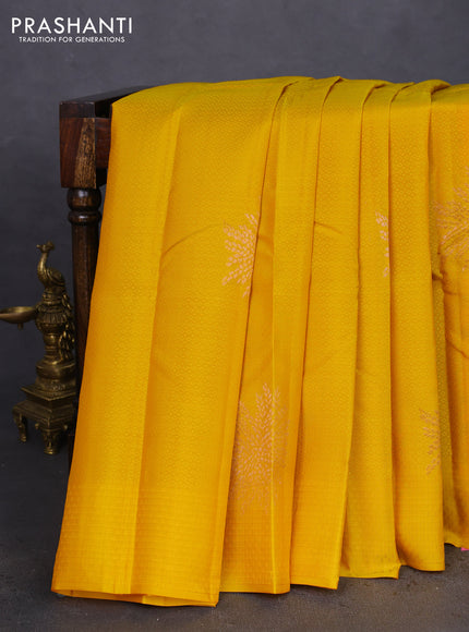 Kanchipuram silk saree yellow and pink with allover self emboss & copper zari buttas in borderless style