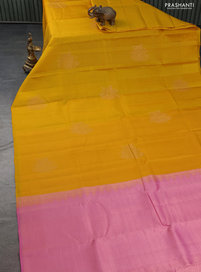 Kanchipuram silk saree yellow and pink with allover self emboss & copper zari buttas in borderless style