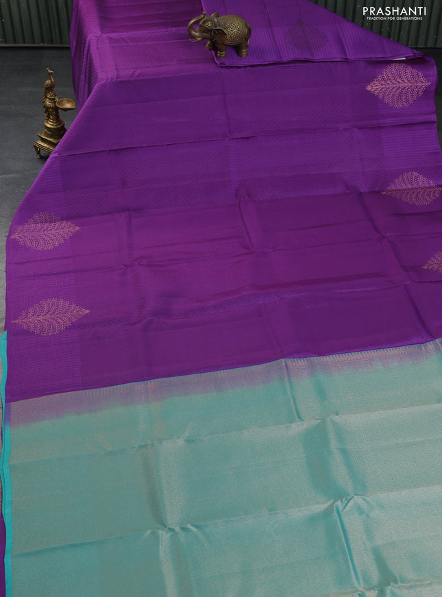 Kanchipuram silk saree purple and teal blue with allover self emboss and copper zari woven buttas