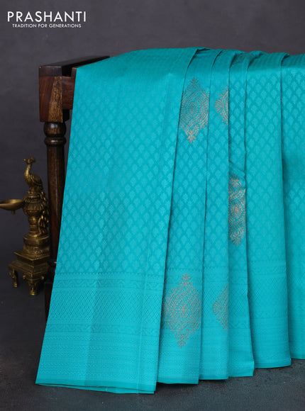 Kanchipuram silk saree teal blue and dual shade of pinkish orange with allover self emboss & copper zari buttas in borderless style