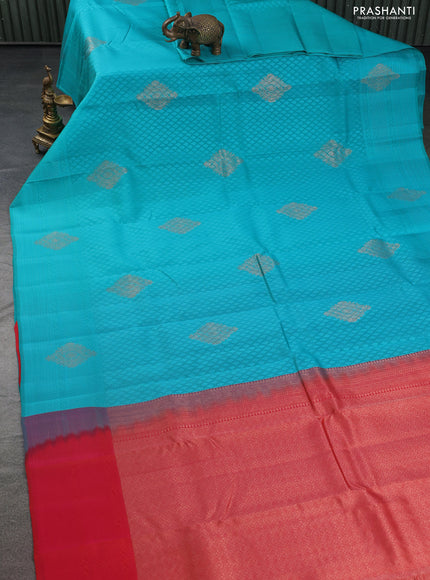 Kanchipuram silk saree teal blue and dual shade of pinkish orange with allover self emboss & copper zari buttas in borderless style