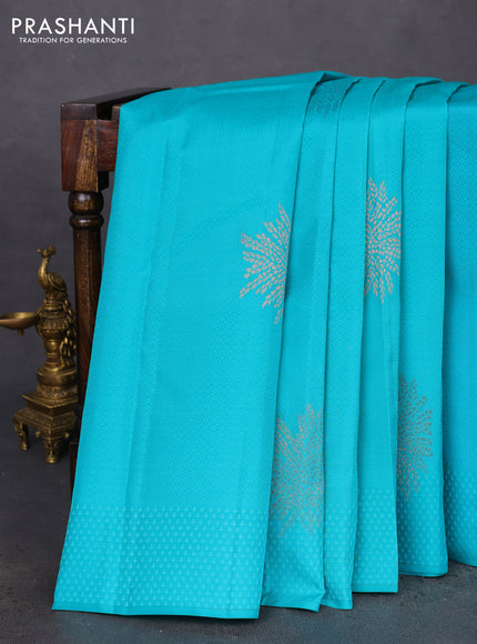Kanchipuram silk saree teal blue and peach pink with allover self emboss & copper zari buttas in borderless style
