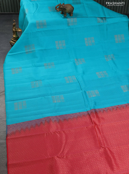 Kanchipuram silk saree teal blue and reddish orange with allover self emboss & copper zari buttas in borderless style