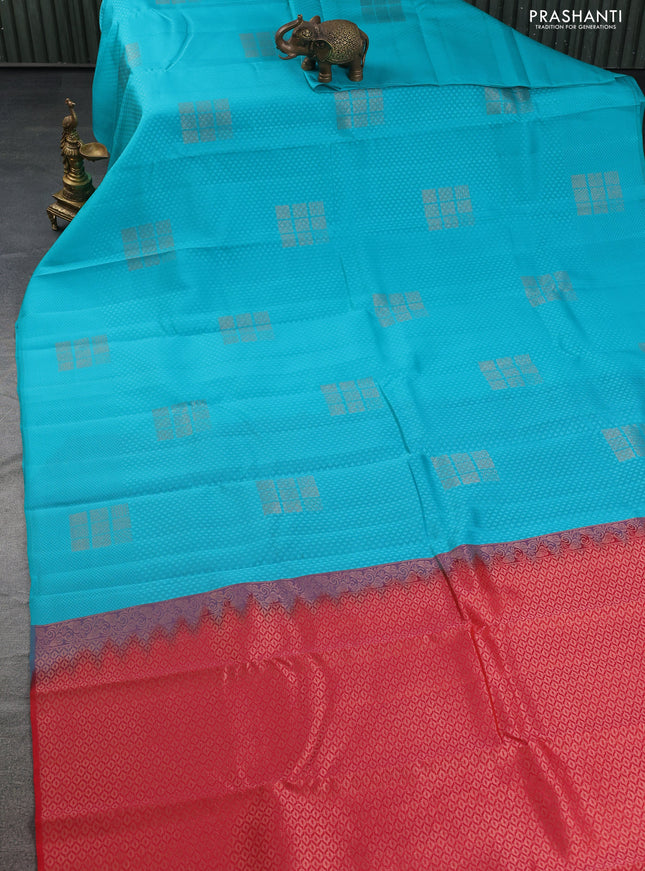 Kanchipuram silk saree teal blue and reddish orange with allover self emboss & copper zari buttas in borderless style
