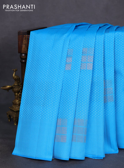 Kanchipuram silk saree light blue and red with allover self emboss & copper zari buttas in borderless style