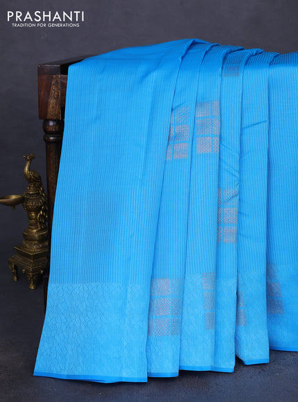 Kanchipuram silk saree blue and reddish pink with allover self emboss & copper zari buttas in borderless style