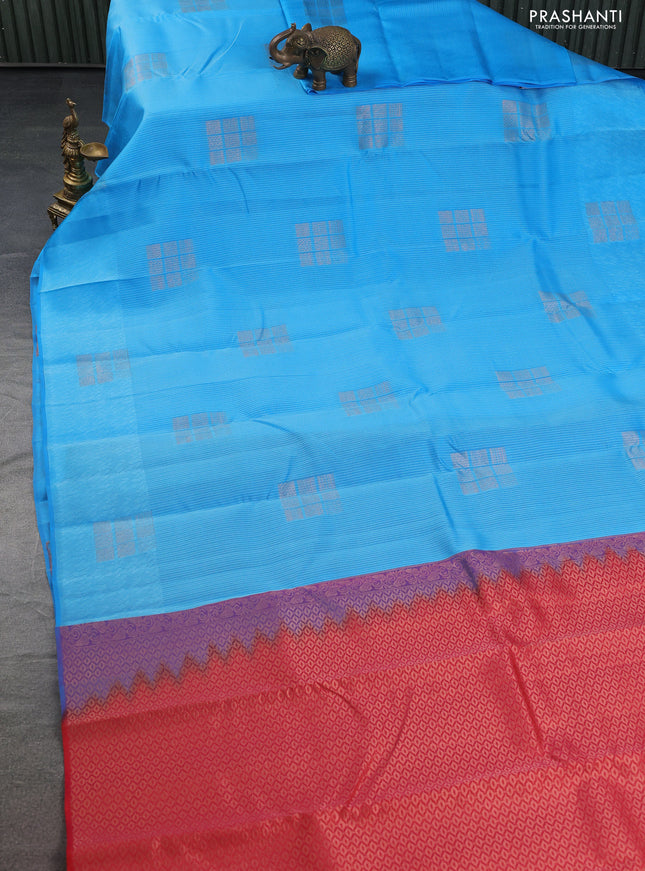 Kanchipuram silk saree blue and reddish pink with allover self emboss & copper zari buttas in borderless style