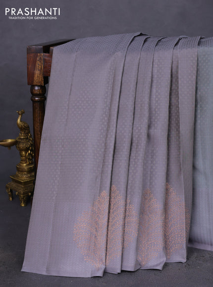 Kanchipuram silk saree grey and teal blue with allover self emboss and copper zari woven butta border